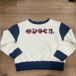 Gucci kids white and blue sweater.